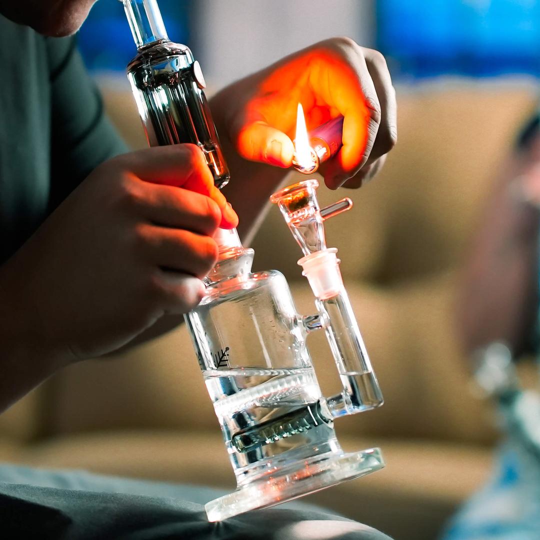 Person lighting Freeze Pipe Mini Bong with freezable coil for smoother hits