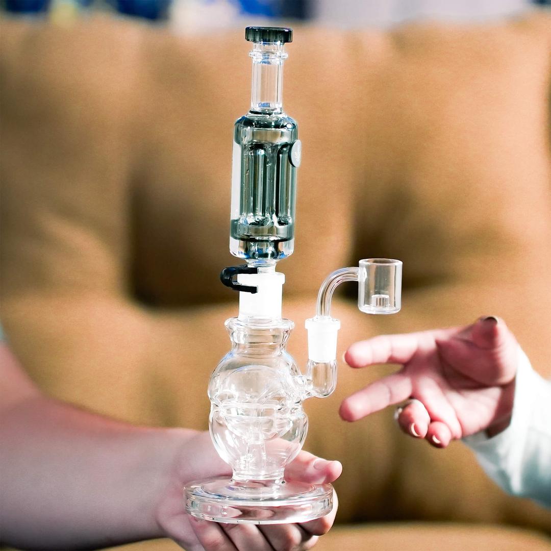 Hand holding Freeze Pipe Mini Dab Rig during session, showing ergonomic design and chilled glycerin coil.