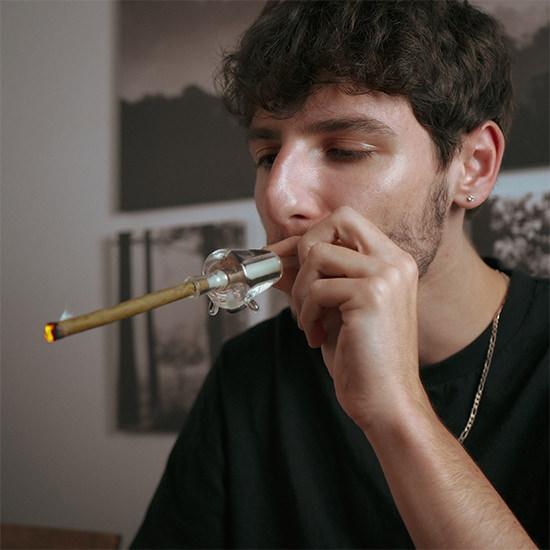 Person using Freeze Pipe Joint Chiller — Smooth, Cooled Smoking Experience