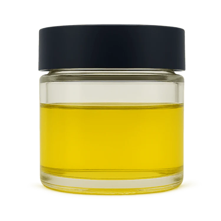 CBC Distillate in a clear glass jar, showcasing premium Cannabichromene extract with a golden hue.