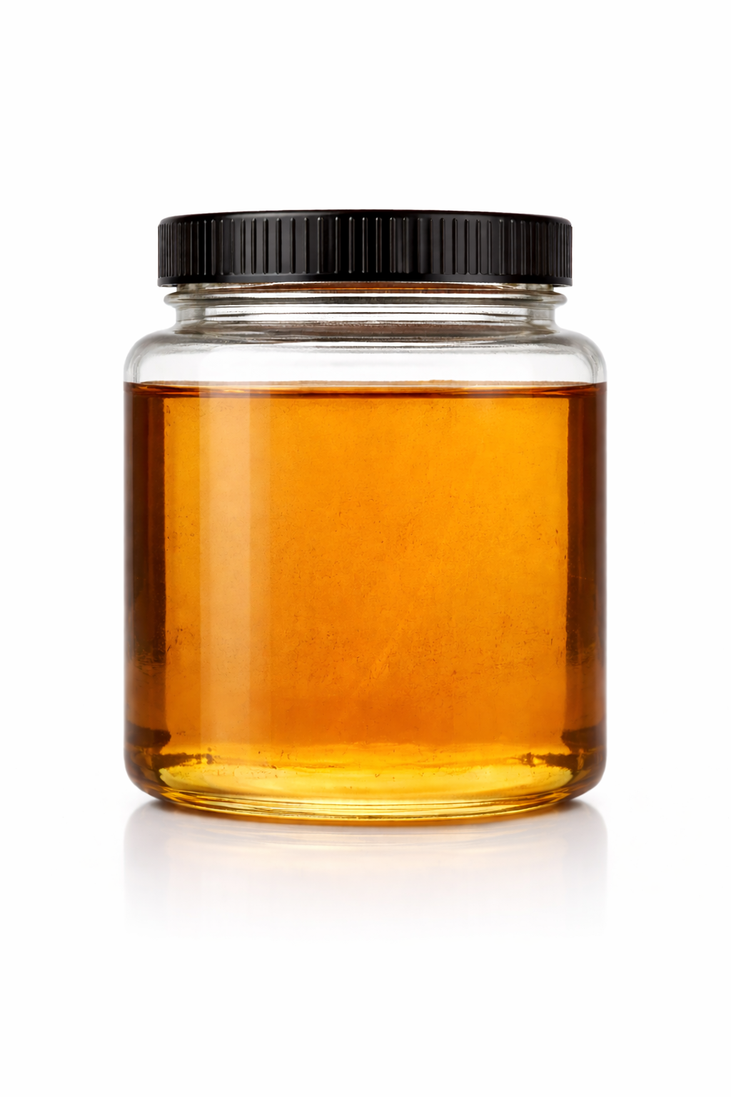 Clear glass jar with black screw-on lid filled with golden amber CBD CRD distillate, photographed on a clean white background