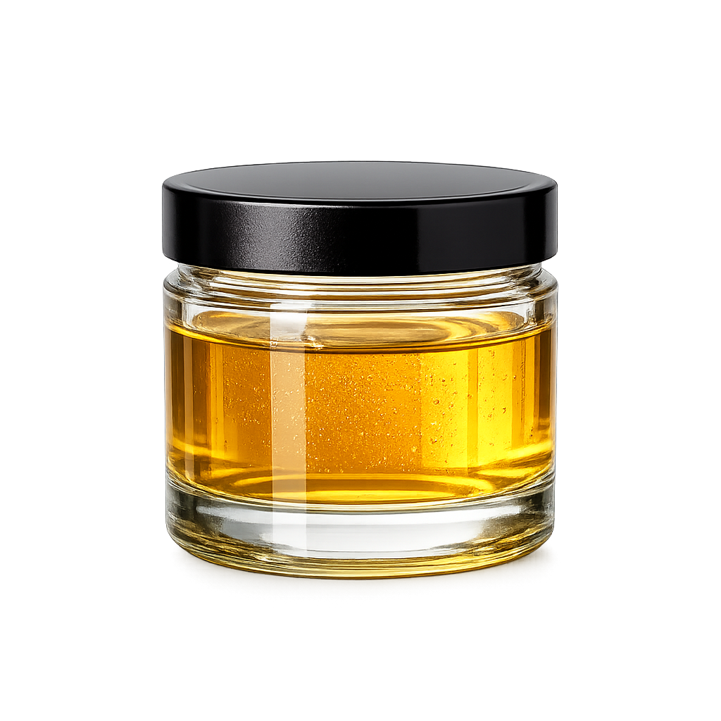 Small clear glass jar with black screw-on lid filled with golden CBG CRD distillate for bulk